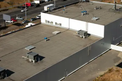 A commercial building with a new roof like the ones provided by Burroughs Roofing